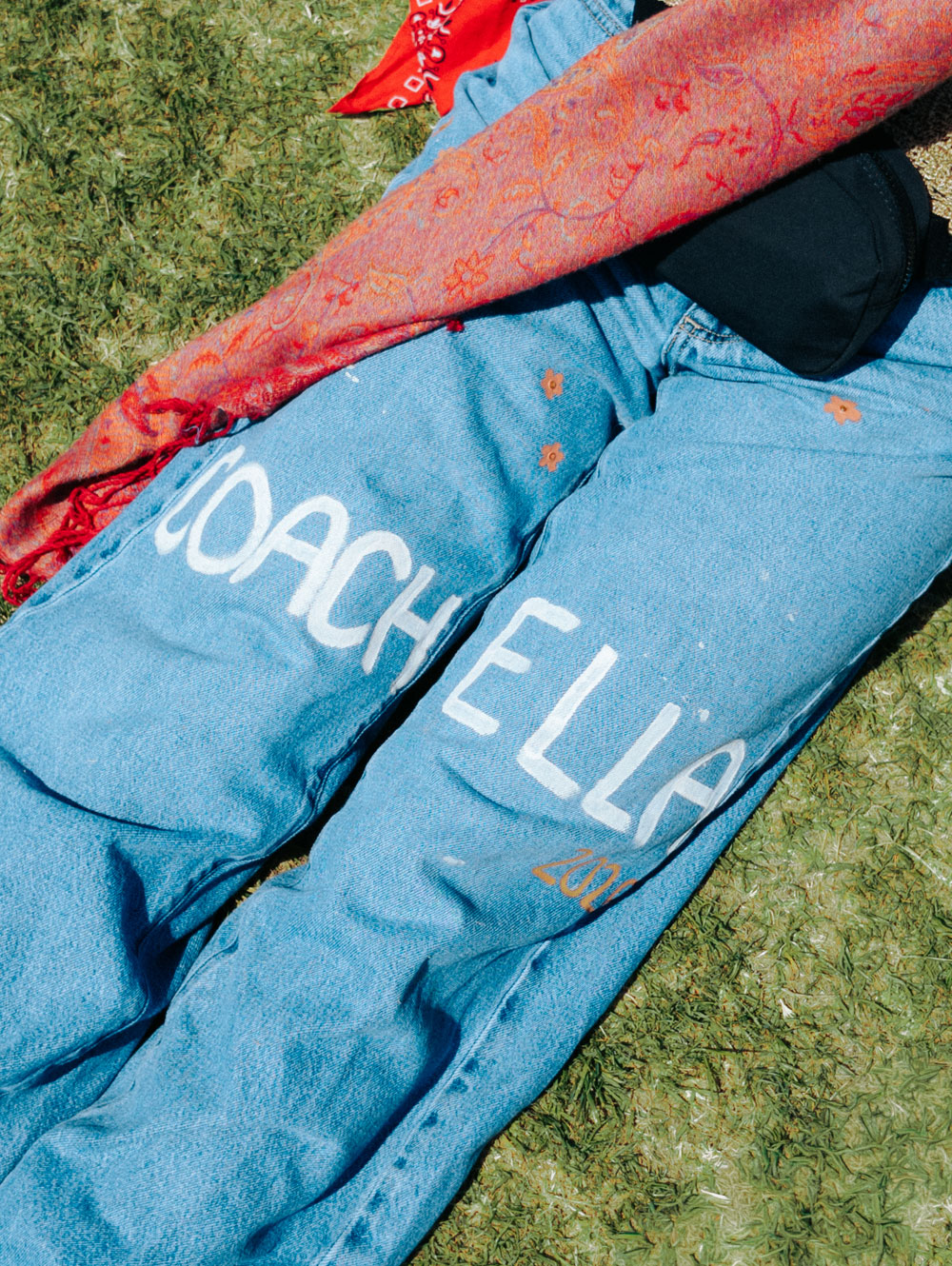 fan's jeans with Coachella printed on them